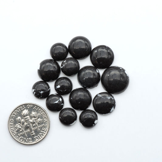 These White Buffalo Cabochons are expertly cut and polished from composite material, resulting in a stunning and long-lasting gemstone.