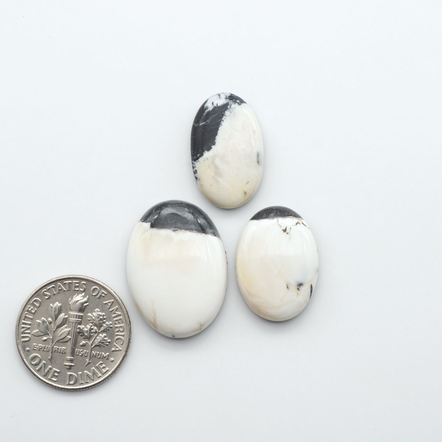 Natural White Buffalo Stone Cabochons are semi-precious gemstones cut into shapes ideal for jewelry-making, making them an excellent choice for artisans.