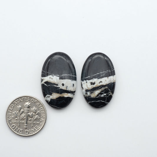 Natural White Buffalo Stone Cabochons are semi-precious gemstones cut into shapes ideal for jewelry-making, making them an excellent choice for artisans.