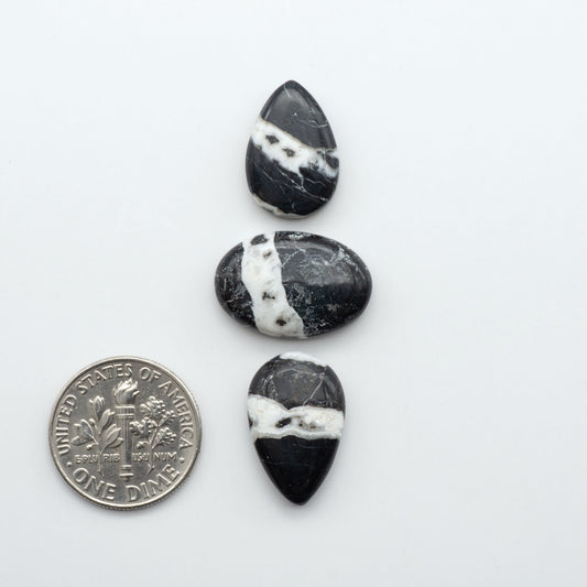 Natural White Buffalo Stone Cabochons are semi-precious gemstones cut into shapes ideal for jewelry-making, making them an excellent choice for artisans.