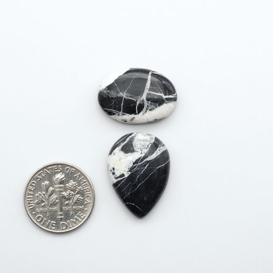 Natural White Buffalo Stone Cabochons are semi-precious gemstones cut into shapes ideal for jewelry-making, making them an excellent choice for artisans.