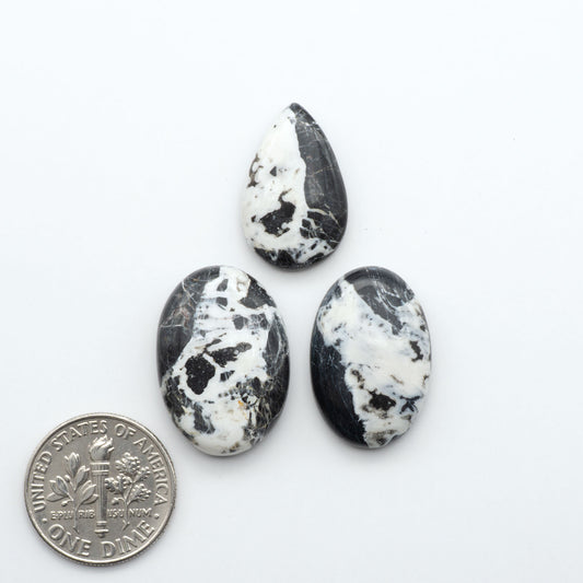 Natural White Buffalo Stone Cabochons are semi-precious gemstones cut into shapes ideal for jewelry-making, making them an excellent choice for artisans.