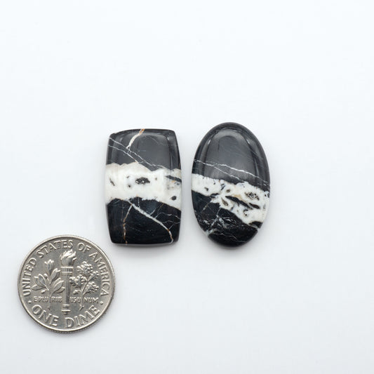Natural White Buffalo Stone Cabochons are semi-precious gemstones cut into shapes ideal for jewelry-making, making them an excellent choice for artisans.