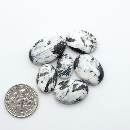 Natural White Buffalo Stone Cabochons are semi-precious gemstones cut into shapes ideal for jewelry-making, making them an excellent choice for artisans.