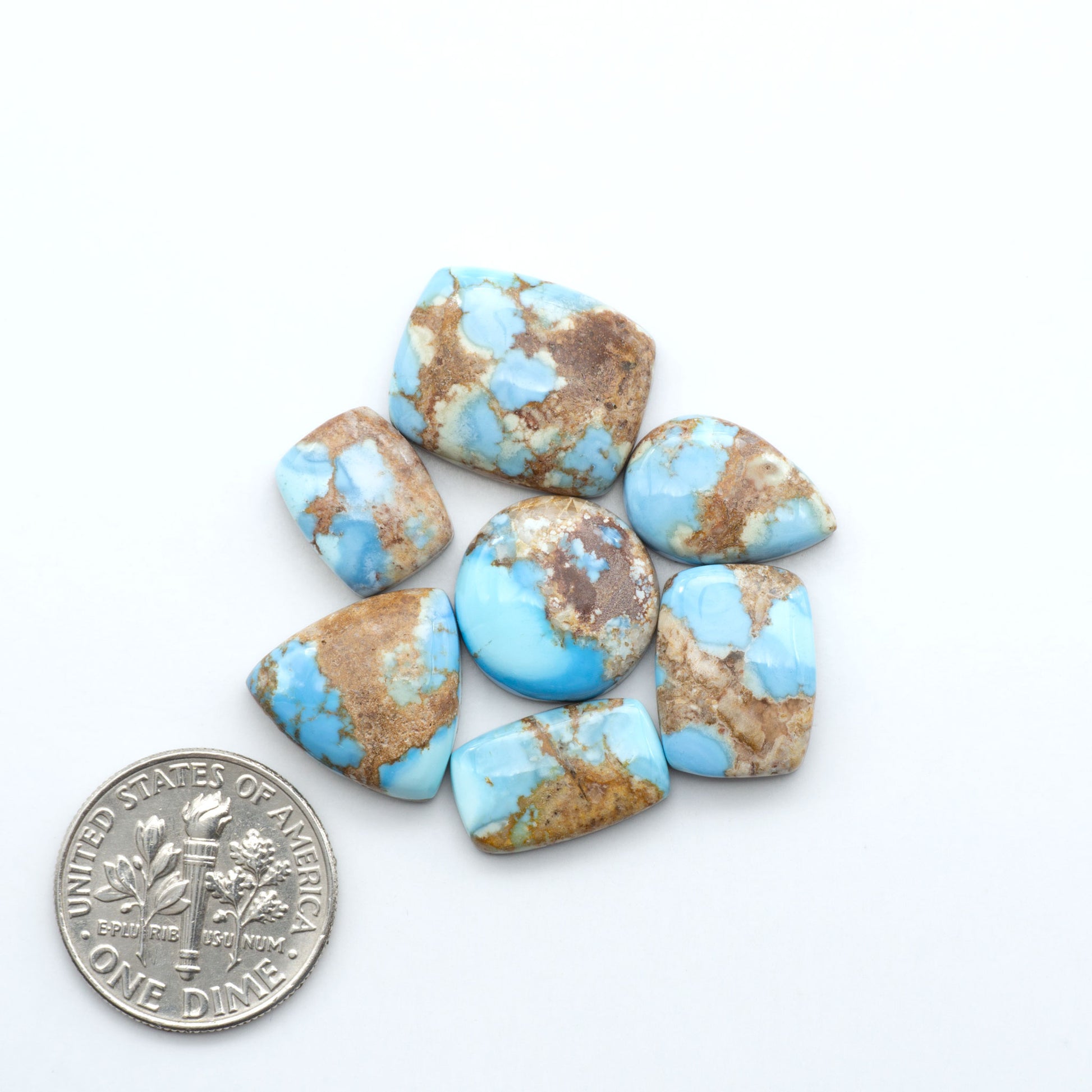 Discover the beauty of Natural Golden Hills Turquoise—prized for its icy blue tones, golden matrix, and exceptional quality. Ideal for artisan jewelry designs.
