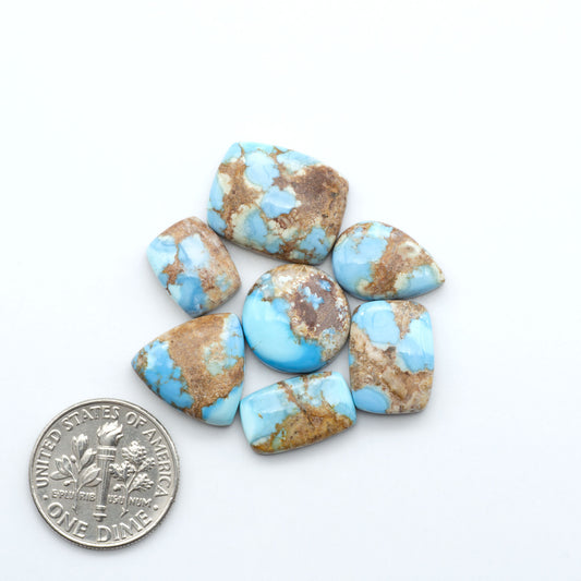 Discover the beauty of Natural Golden Hills Turquoise—prized for its icy blue tones, golden matrix, and exceptional quality. Ideal for artisan jewelry designs.
