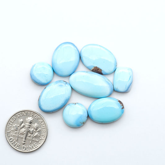 Discover the beauty of Natural Golden Hills Turquoise—prized for its icy blue tones, golden matrix, and exceptional quality. Ideal for artisan jewelry designs.
