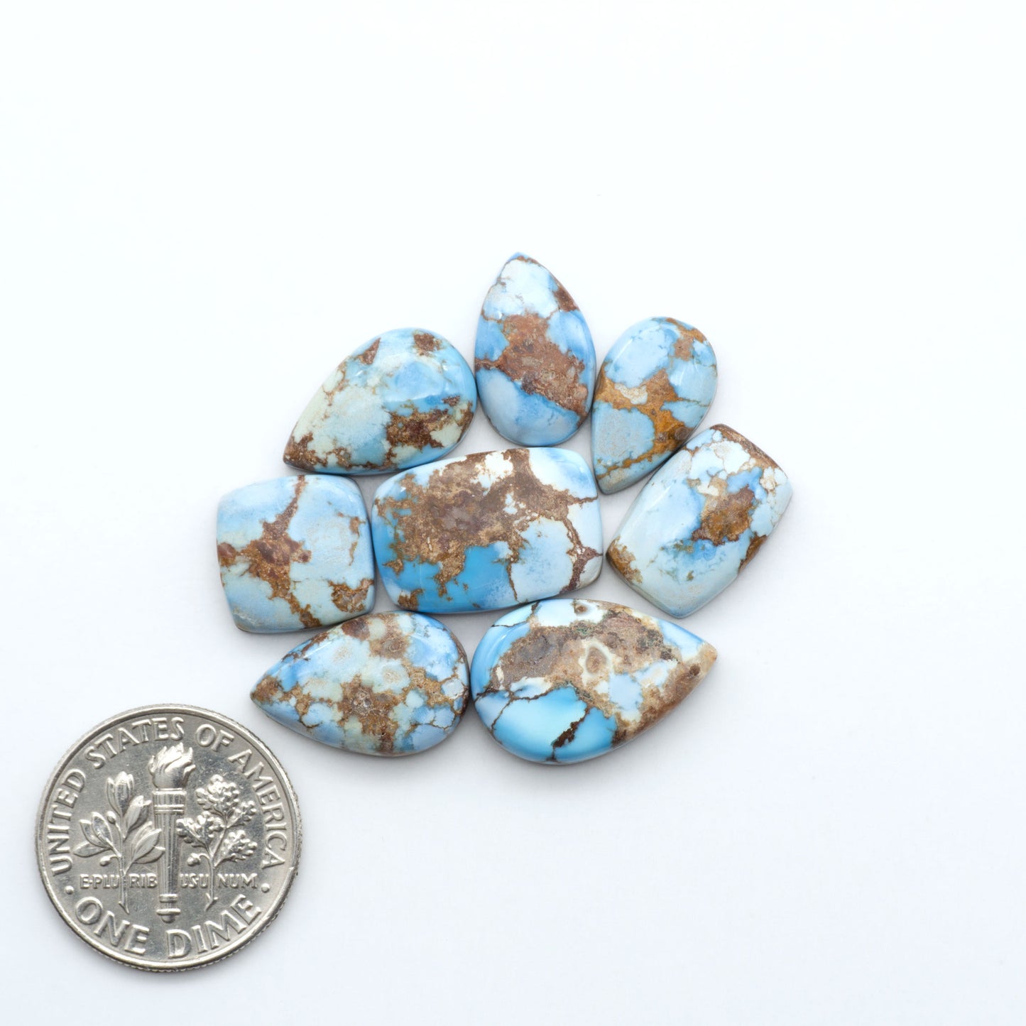 Discover the beauty of Natural Golden Hills Turquoise—prized for its icy blue tones, golden matrix, and exceptional quality. Ideal for artisan jewelry designs.
