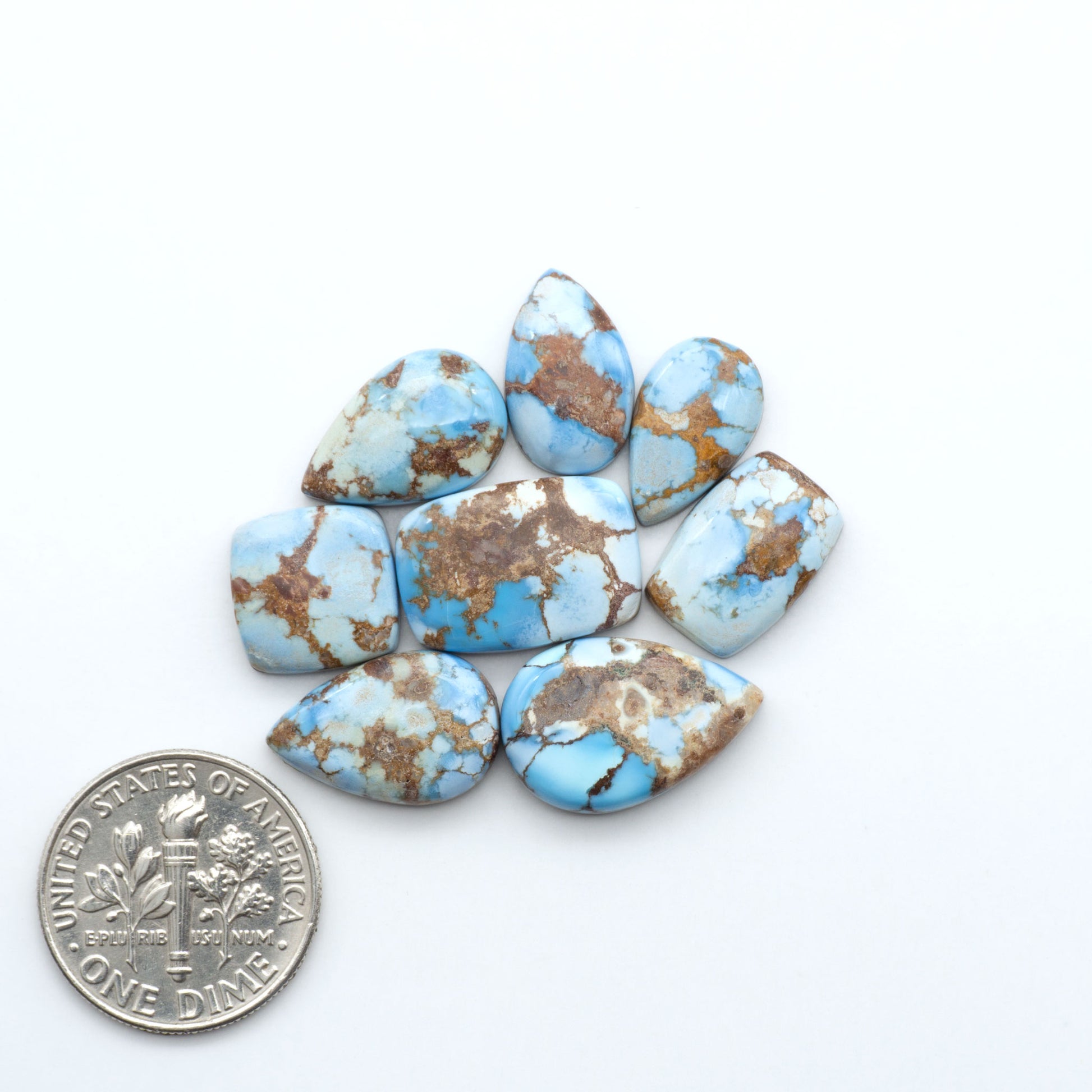 Discover the beauty of Natural Golden Hills Turquoise—prized for its icy blue tones, golden matrix, and exceptional quality. Ideal for artisan jewelry designs.
