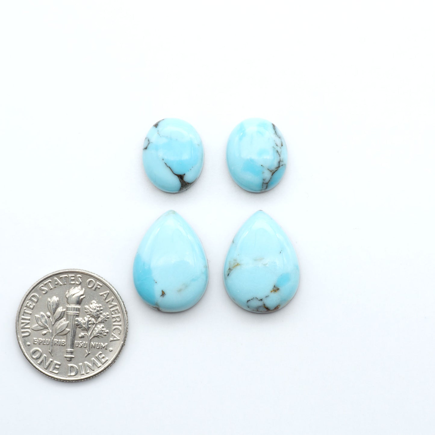 Enhance your jewelry designs with Pressed Turquoise Nugget Cabochons. Crafted from composite materials they add a captivating touch to your creations.