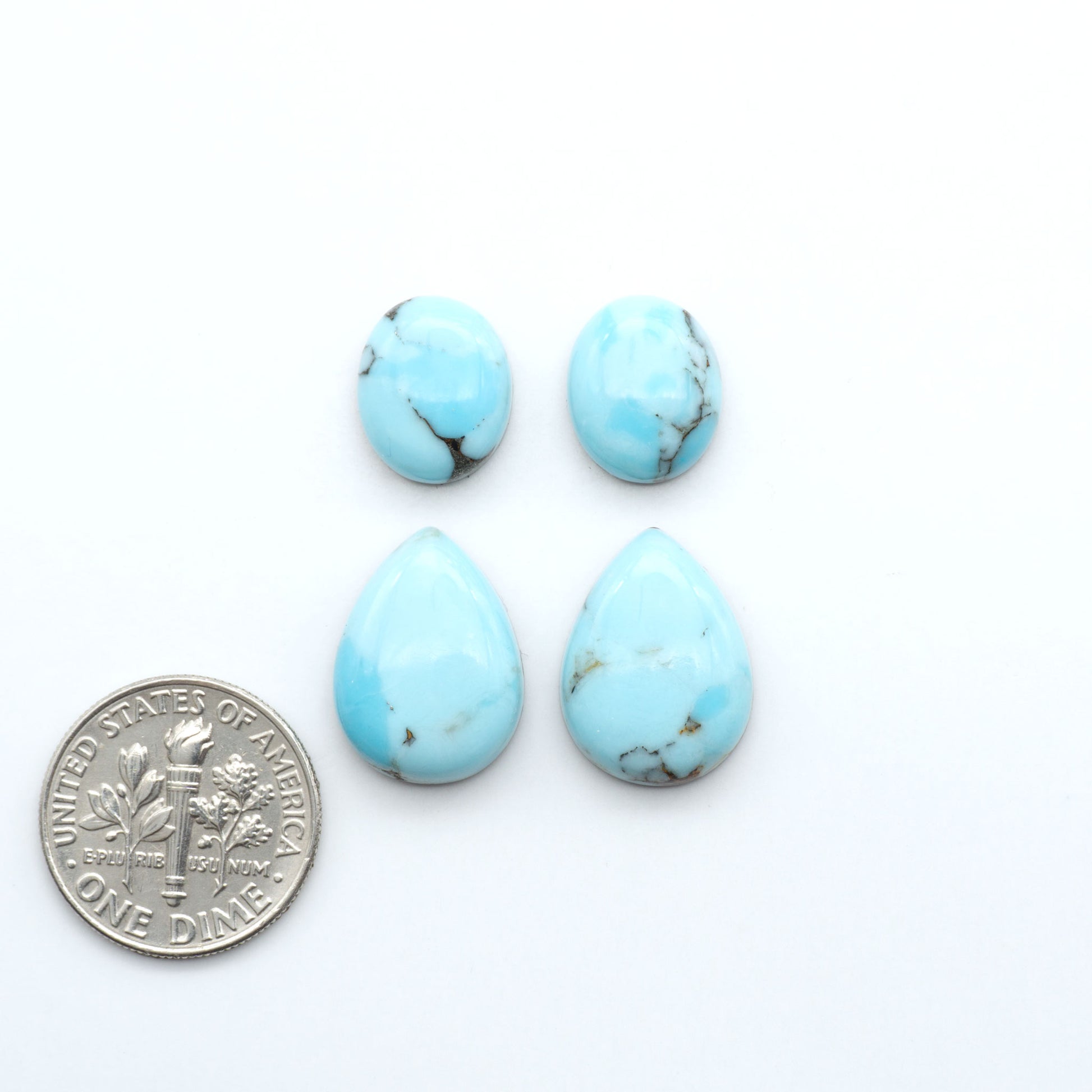 Enhance your jewelry designs with Pressed Turquoise Nugget Cabochons. Crafted from composite materials they add a captivating touch to your creations.