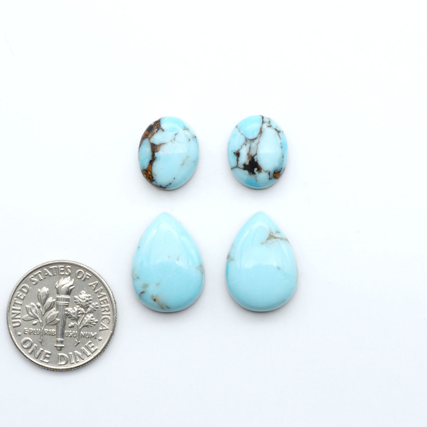 Enhance your jewelry designs with Pressed Turquoise Nugget Cabochons. Crafted from composite materials they add a captivating touch to your creations.
