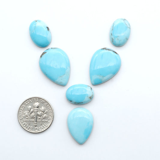 Enhance your jewelry designs with Pressed Turquoise Nugget Cabochons. Crafted from composite materials they add a captivating touch to your creations.