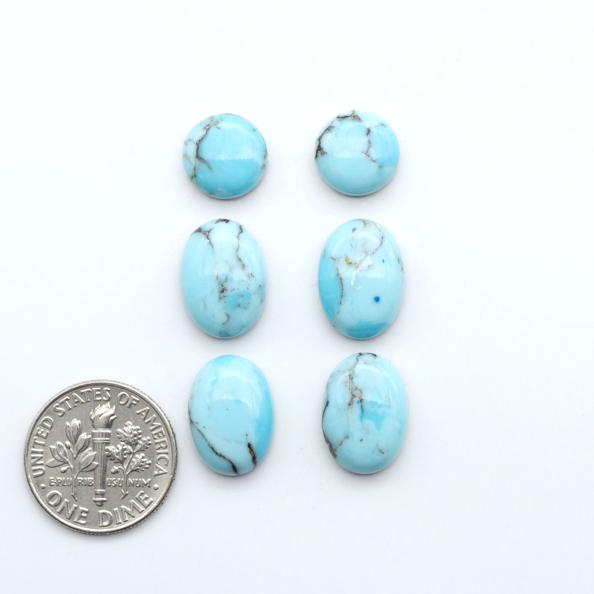 Enhance your jewelry designs with Pressed Turquoise Nugget Cabochons. Crafted from composite materials they add a captivating touch to your creations.