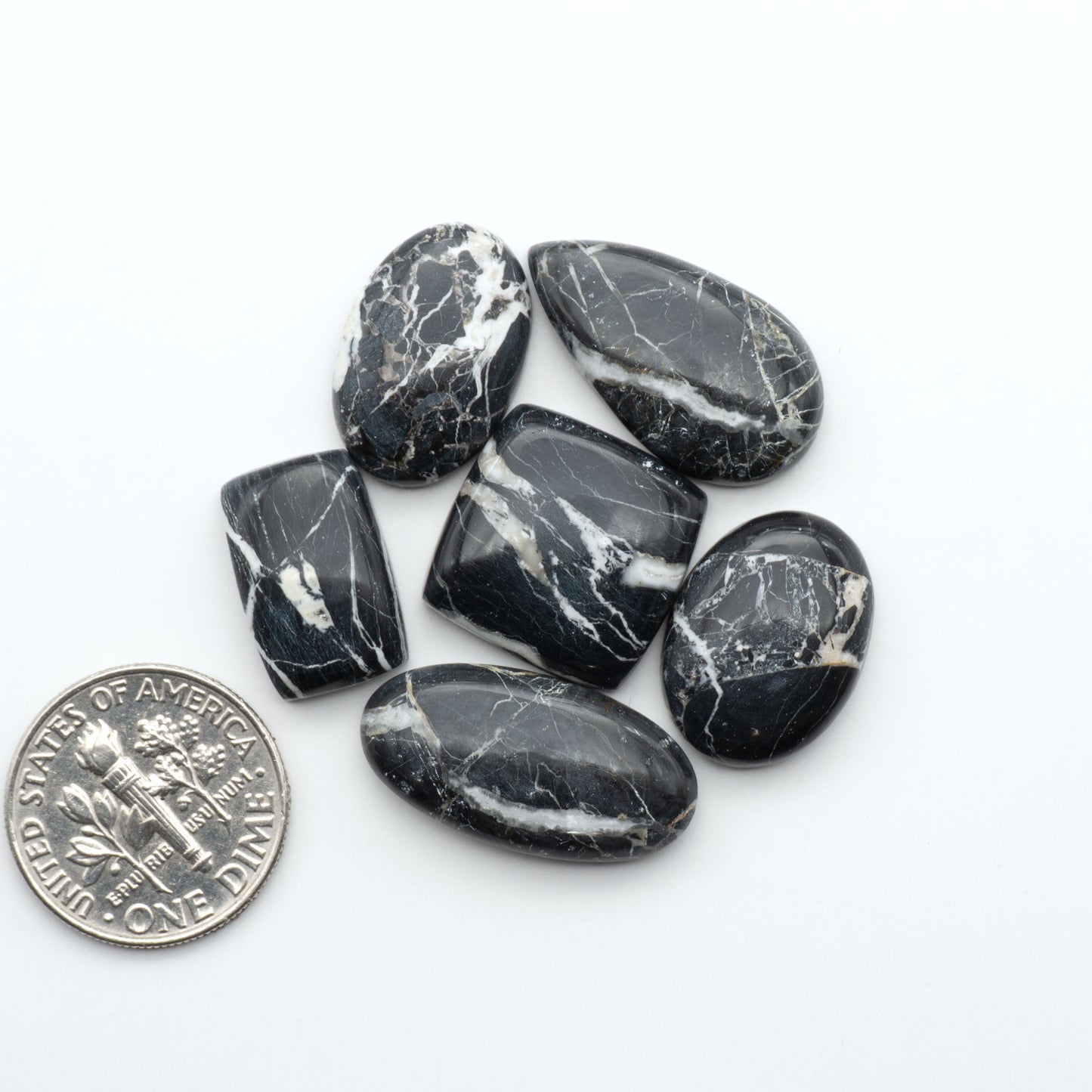Natural White Buffalo Stone Cabochons are semi-precious gemstones cut into shapes ideal for jewelry-making, making them an excellent choice for artisans.