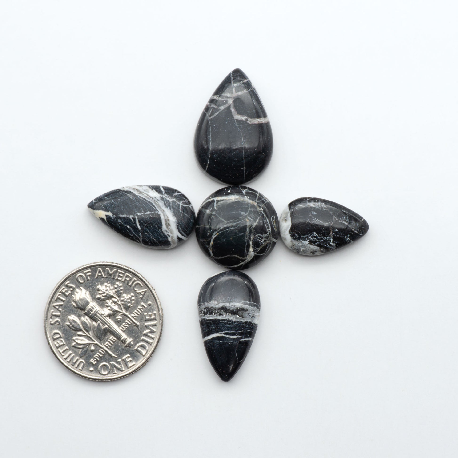 Natural White Buffalo Stone Cabochons are semi-precious gemstones cut into shapes ideal for jewelry-making, making them an excellent choice for artisans.