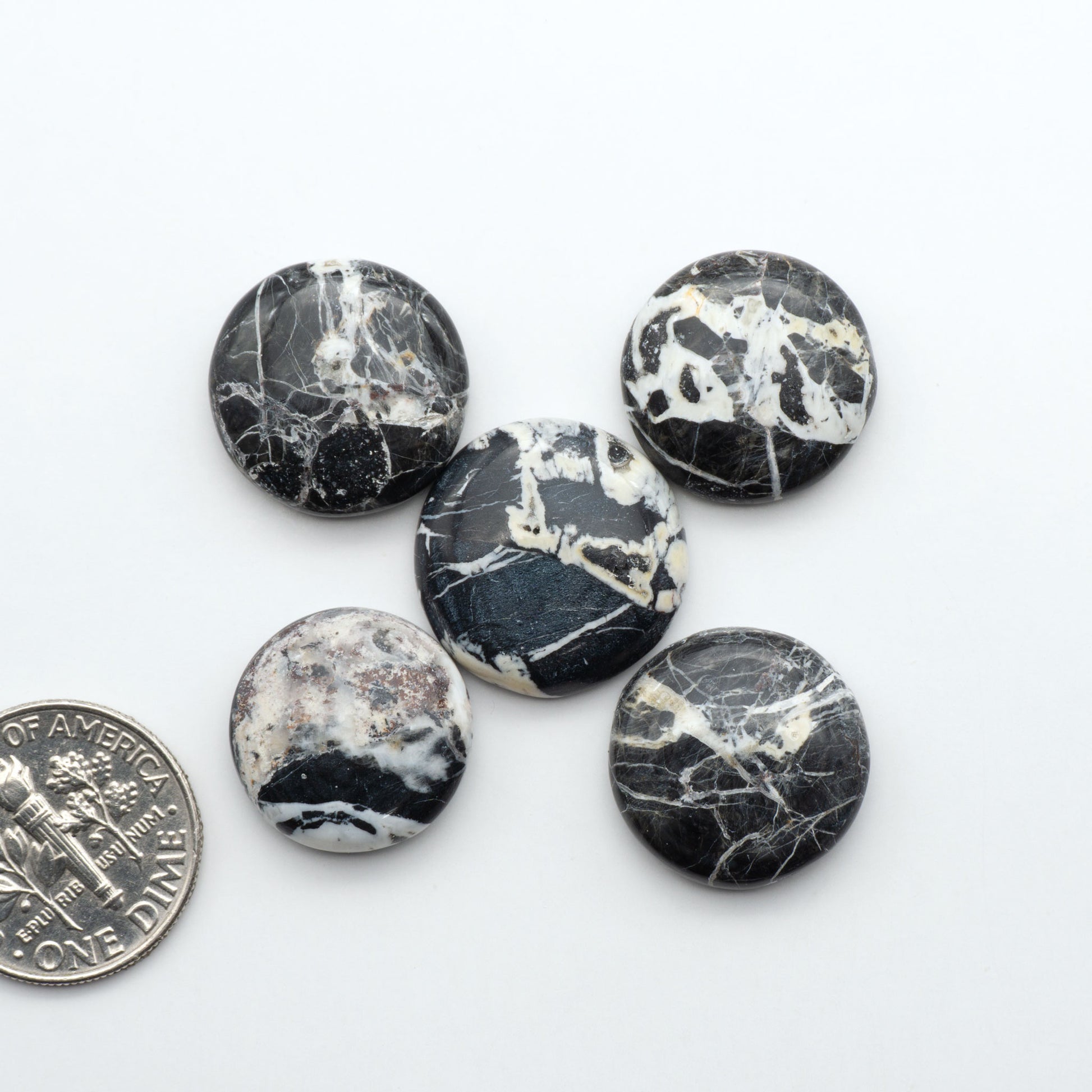 Natural White Buffalo Stone Cabochons are semi-precious gemstones cut into shapes ideal for jewelry-making, making them an excellent choice for artisans.