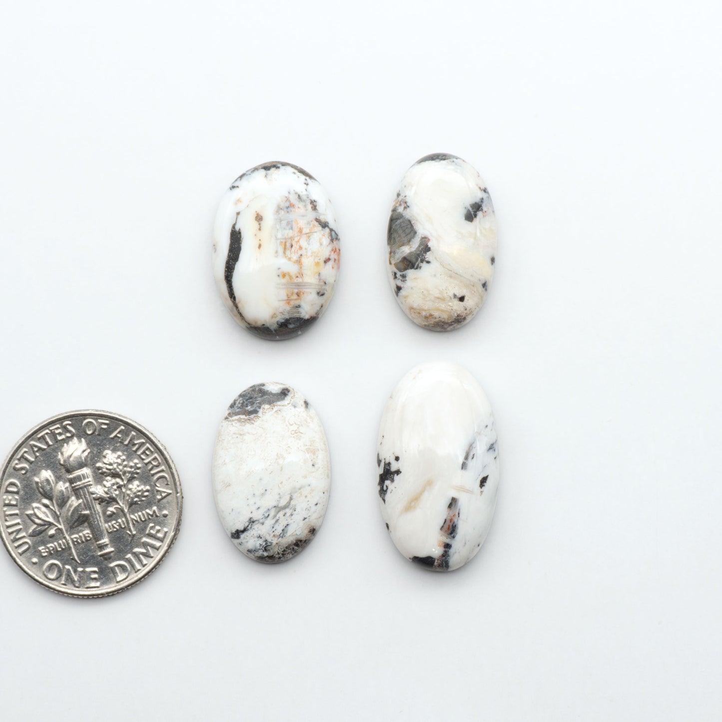 Natural White Buffalo Stone Cabochons are semi-precious gemstones cut into shapes ideal for jewelry-making, making them an excellent choice for artisans.