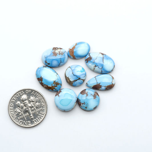 Discover the beauty of Natural Golden Hills Turquoise—prized for its icy blue tones, golden matrix, and exceptional quality. Ideal for artisan jewelry designs.