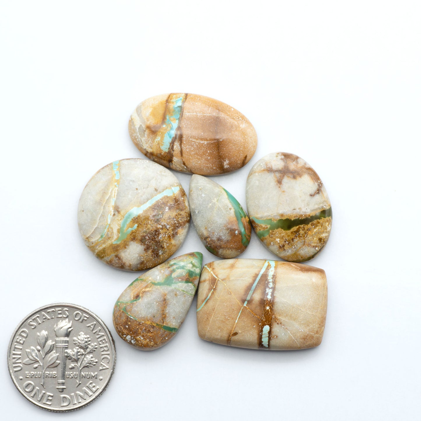 Royston Turquoise cabochons are famous for their distinctive matrix and unique green and blue hues, making them a favored option among jewelry designers.