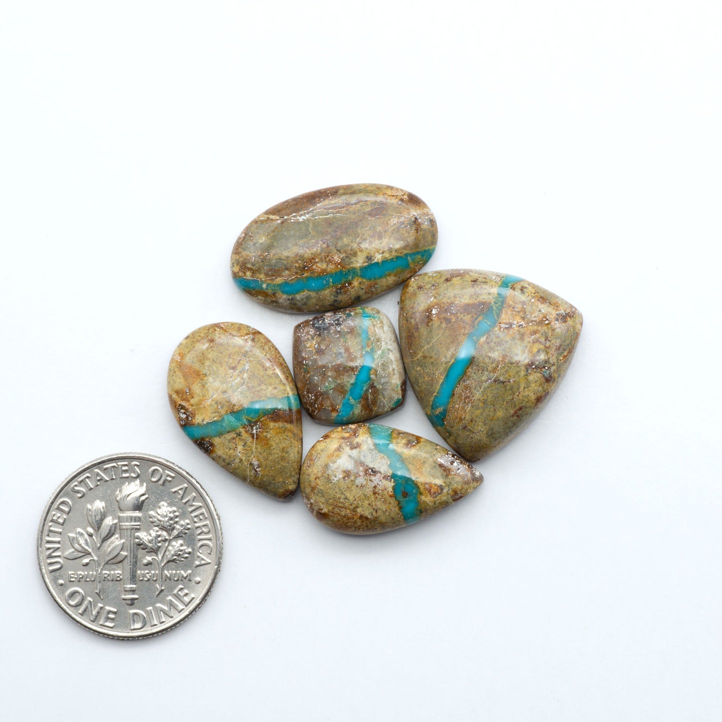 Royston Turquoise cabochons are famous for their distinctive matrix and unique green and blue hues, making them a favored option among jewelry designers.