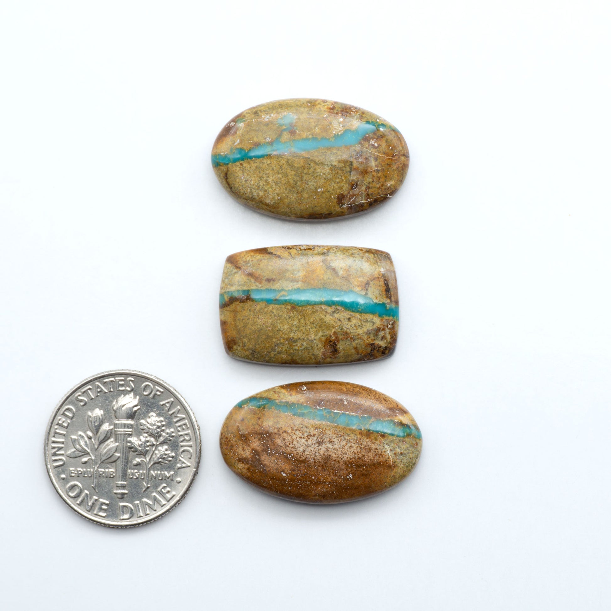 Royston Turquoise cabochons are famous for their distinctive matrix and unique green and blue hues, making them a favored option among jewelry designers.