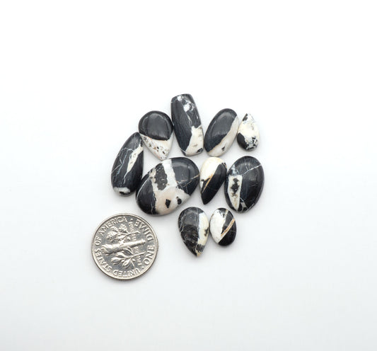 Natural White Buffalo Stone Cabochons are semi-precious gemstones cut into shapes ideal for jewelry-making, making them an excellent choice for artisans.