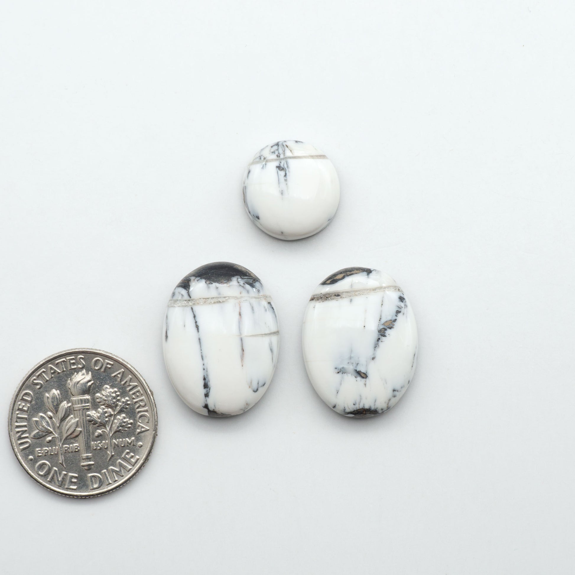 Natural White Buffalo Stone Cabochons are semi-precious gemstones cut into shapes ideal for jewelry-making, making them an excellent choice for artisans.