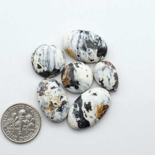 Natural White Buffalo Stone Cabochons are semi-precious gemstones cut into shapes ideal for jewelry-making, making them an excellent choice for artisans.