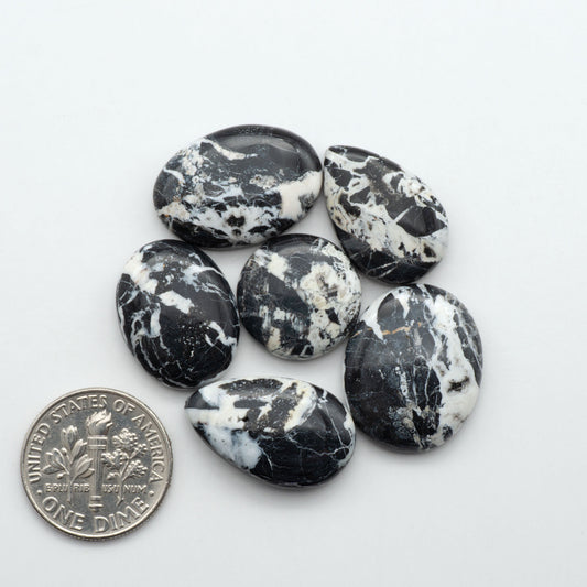 Natural White Buffalo Stone Cabochons are semi-precious gemstones cut into shapes ideal for jewelry-making, making them an excellent choice for artisans.