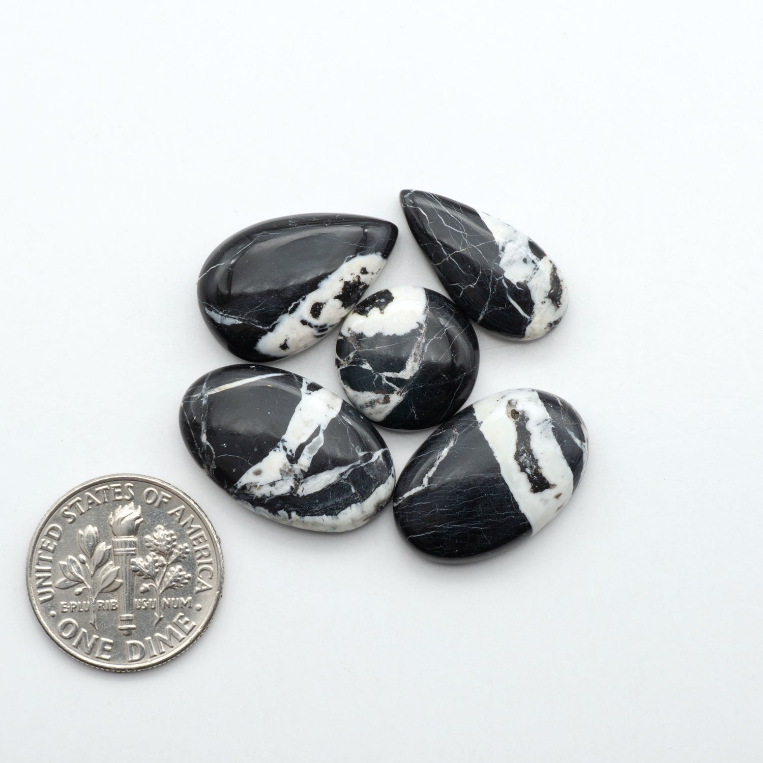 Natural White Buffalo Stone Cabochons are semi-precious gemstones cut into shapes ideal for jewelry-making, making them an excellent choice for artisans.