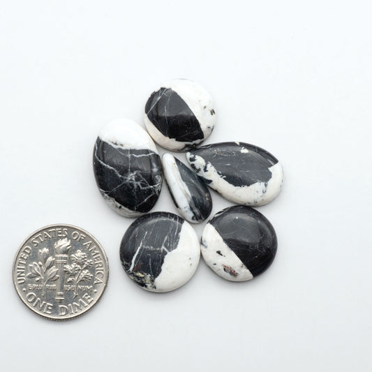 Natural White Buffalo Stone Cabochons are semi-precious gemstones cut into shapes ideal for jewelry-making, making them an excellent choice for artisans.