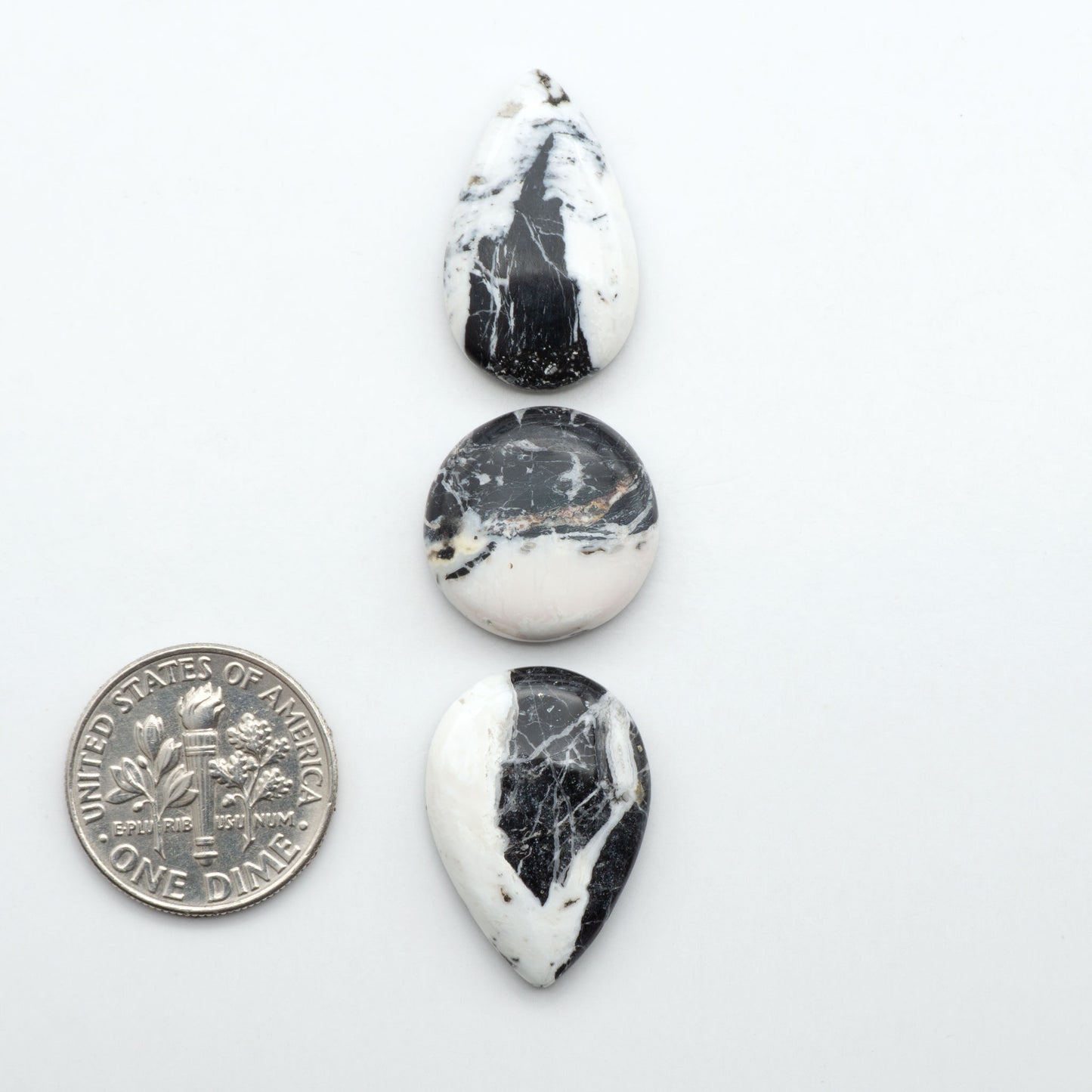 Natural White Buffalo Stone Cabochons are semi-precious gemstones cut into shapes ideal for jewelry-making, making them an excellent choice for artisans.