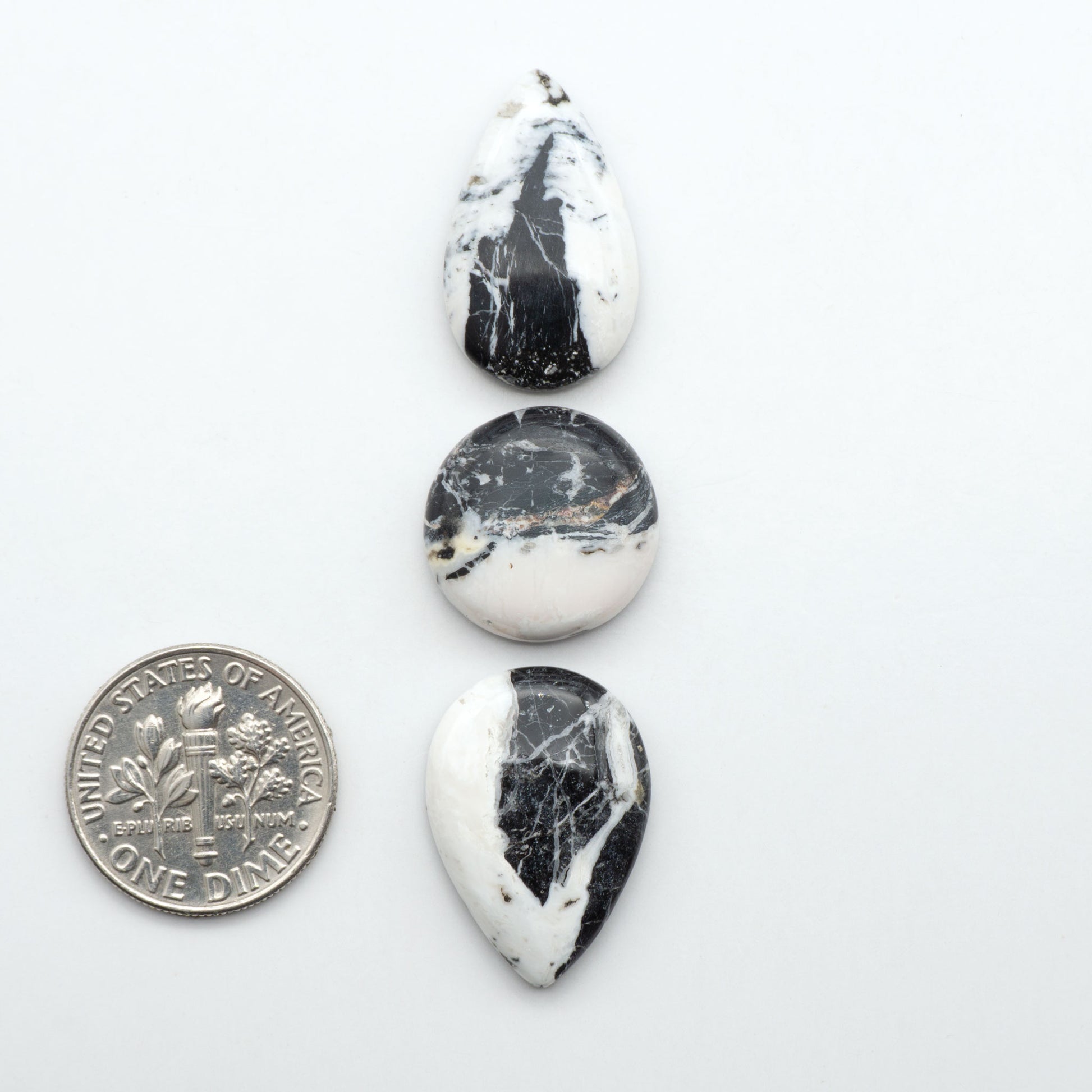 Natural White Buffalo Stone Cabochons are semi-precious gemstones cut into shapes ideal for jewelry-making, making them an excellent choice for artisans.