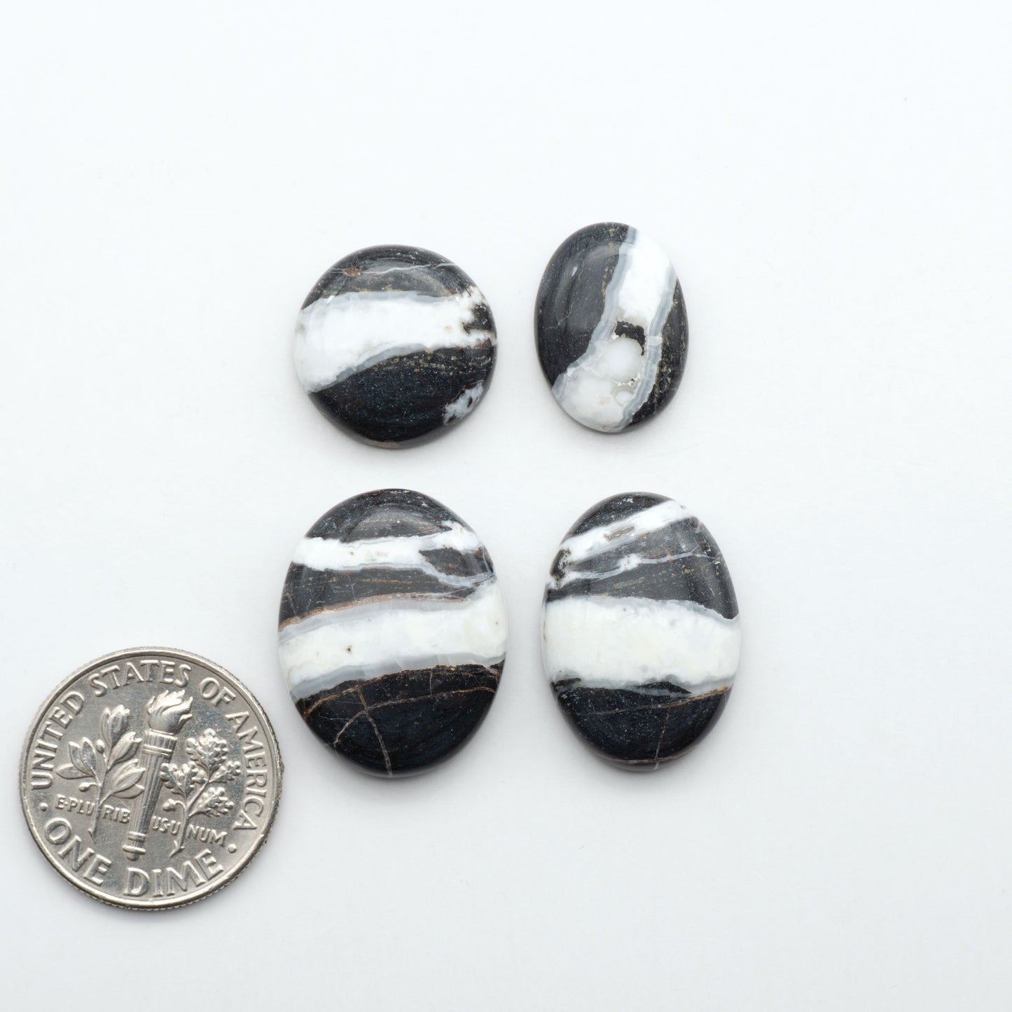 Natural White Buffalo Stone Cabochons are semi-precious gemstones cut into shapes ideal for jewelry-making, making them an excellent choice for artisans.