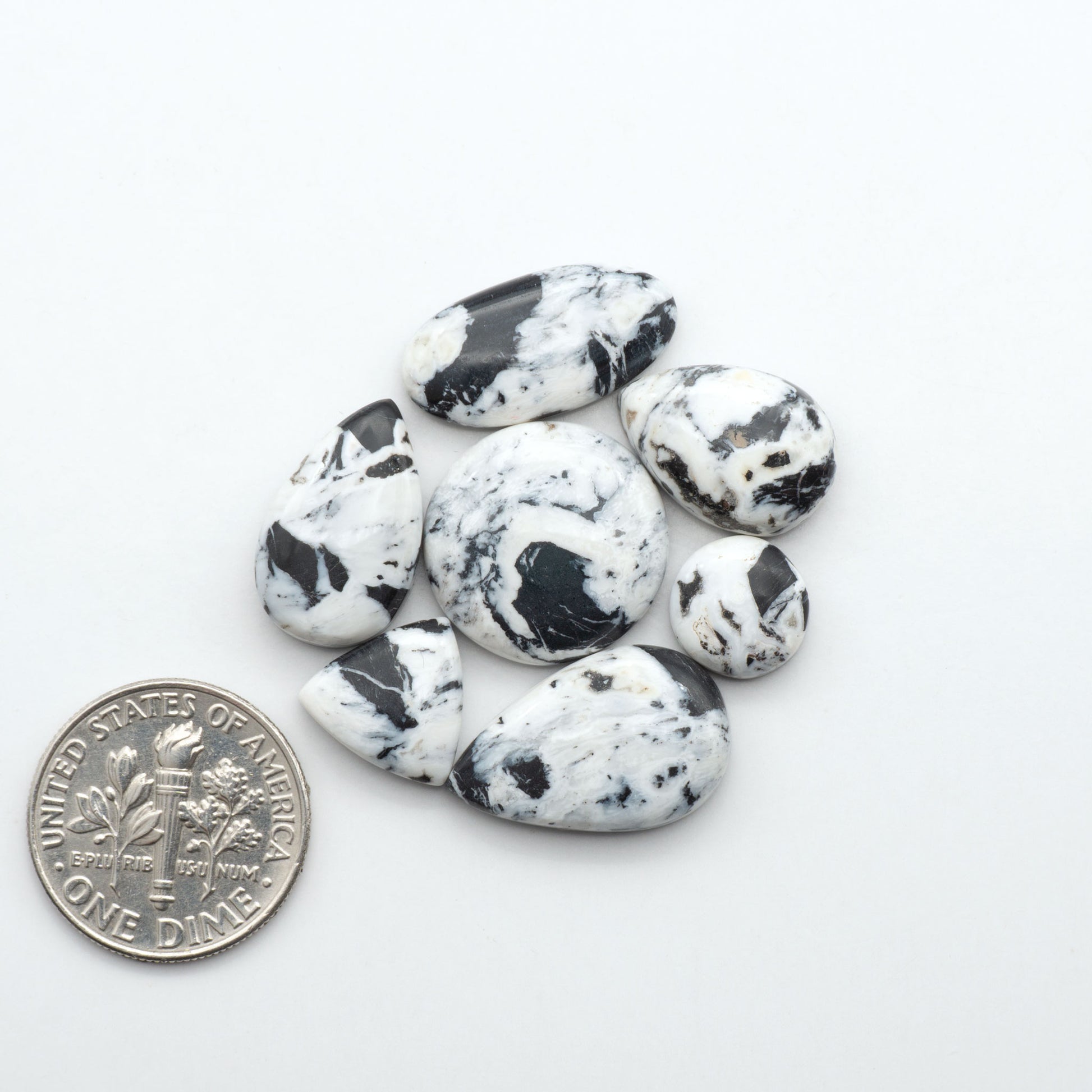 Natural White Buffalo Stone Cabochons are semi-precious gemstones cut into shapes ideal for jewelry-making, making them an excellent choice for artisans.