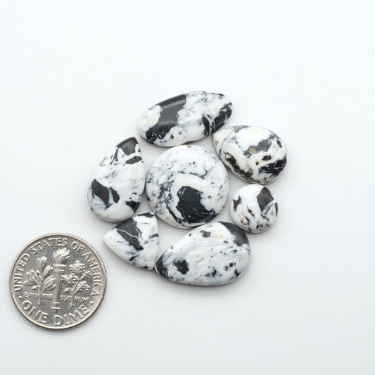 Natural White Buffalo Stone Cabochons are semi-precious gemstones cut into shapes ideal for jewelry-making, making them an excellent choice for artisans.