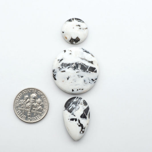 Natural White Buffalo Stone Cabochons are semi-precious gemstones cut into shapes ideal for jewelry-making, making them an excellent choice for artisans.