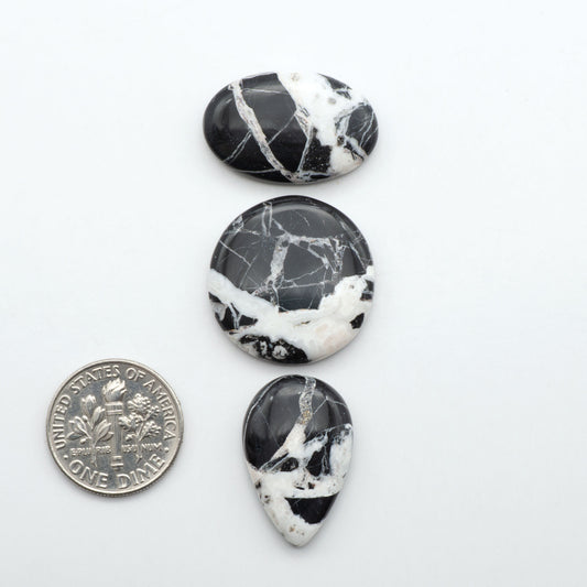 Natural White Buffalo Stone Cabochons are semi-precious gemstones cut into shapes ideal for jewelry-making, making them an excellent choice for artisans.