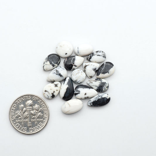 Natural White Buffalo Stone Cabochons are semi-precious gemstones cut into shapes ideal for jewelry-making, making them an excellent choice for artisans.