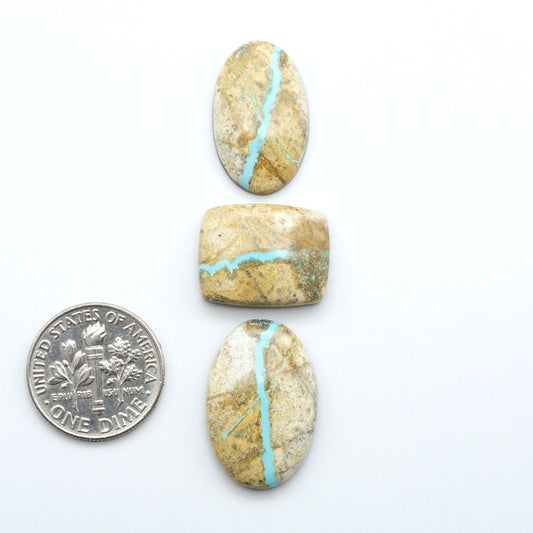 Royston Turquoise cabochons are famous for their distinctive matrix and unique green and blue hues, making them a favored option among jewelry designers.