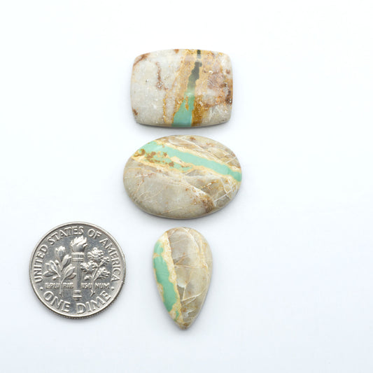 Royston Turquoise cabochons are famous for their distinctive matrix and unique green and blue hues, making them a favored option among jewelry designers.