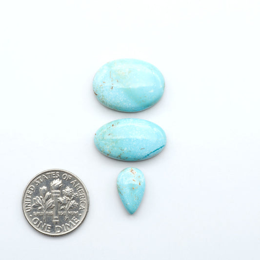 Royston Turquoise cabochons are famous for their distinctive matrix and unique green and blue hues, making them a favored option among jewelry designers.
