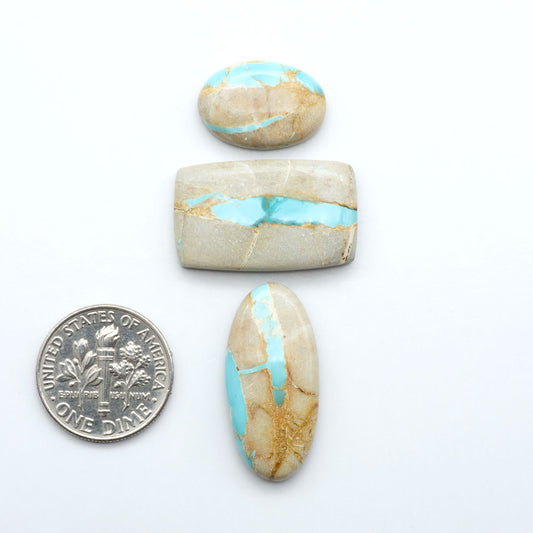 Royston Turquoise cabochons are famous for their distinctive matrix and unique green and blue hues, making them a favored option among jewelry designers.