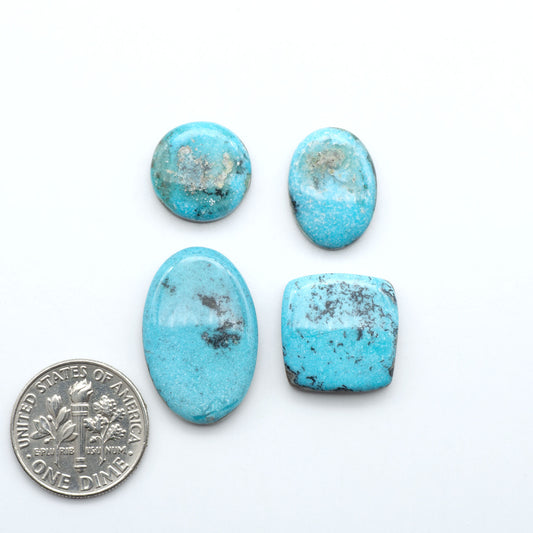 Royston Turquoise cabochons are famous for their distinctive matrix and unique green and blue hues, making them a favored option among jewelry designers.