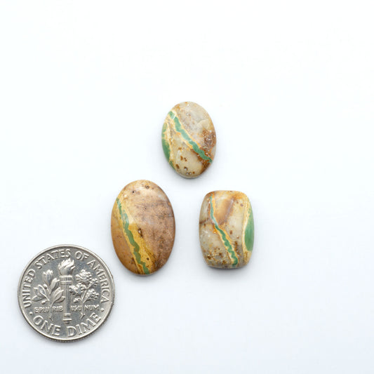 Royston Turquoise cabochons are famous for their distinctive matrix and unique green and blue hues, making them a favored option among jewelry designers.