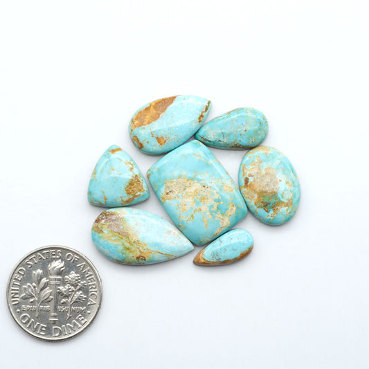 Royston Turquoise cabochons are famous for their distinctive matrix and unique green and blue hues, making them a favored option among jewelry designers.