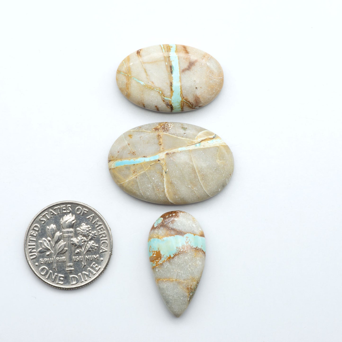 Royston Turquoise cabochons are famous for their distinctive matrix and unique green and blue hues, making them a favored option among jewelry designers.