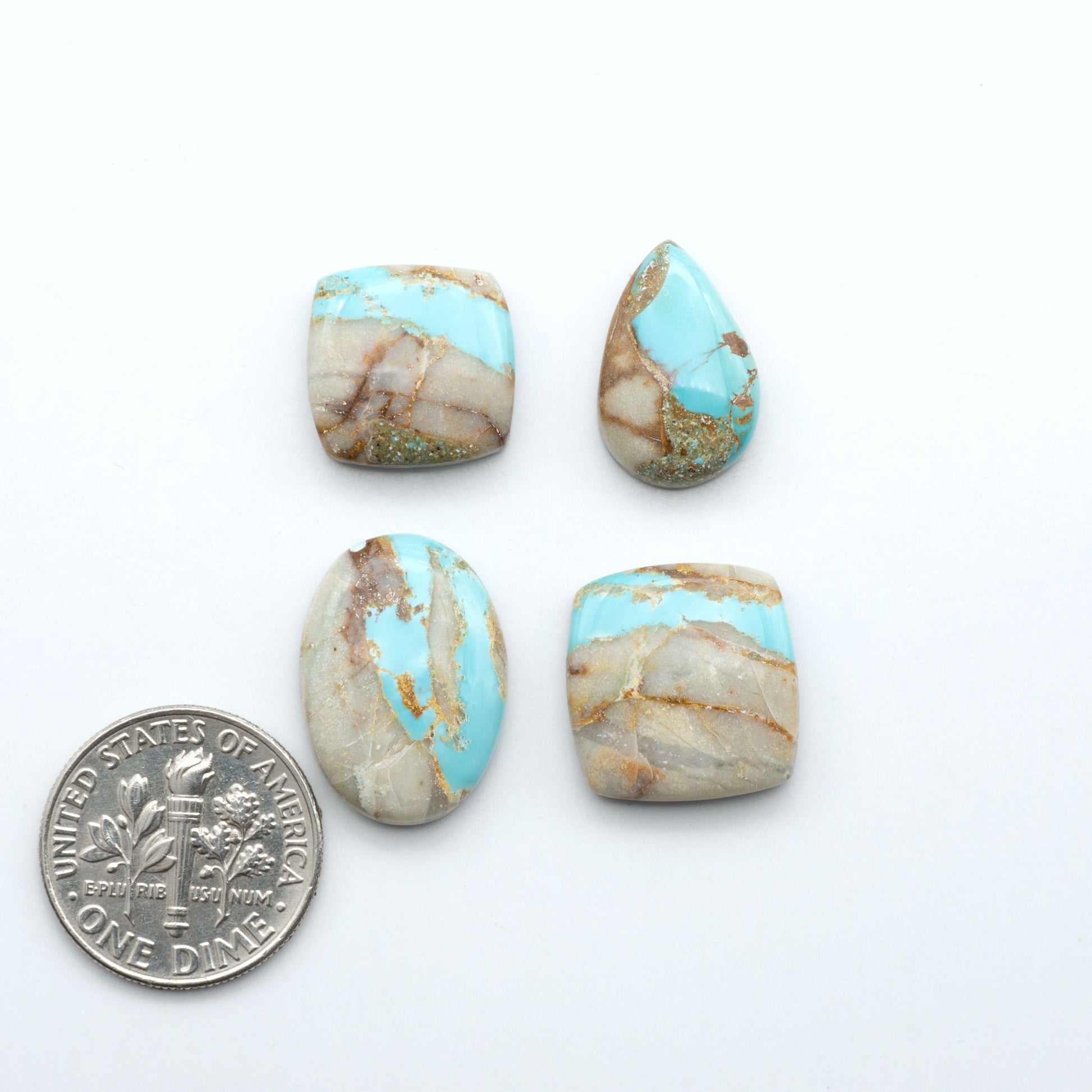 Royston Turquoise cabochons are famous for their distinctive matrix and unique green and blue hues, making them a favored option among jewelry designers.