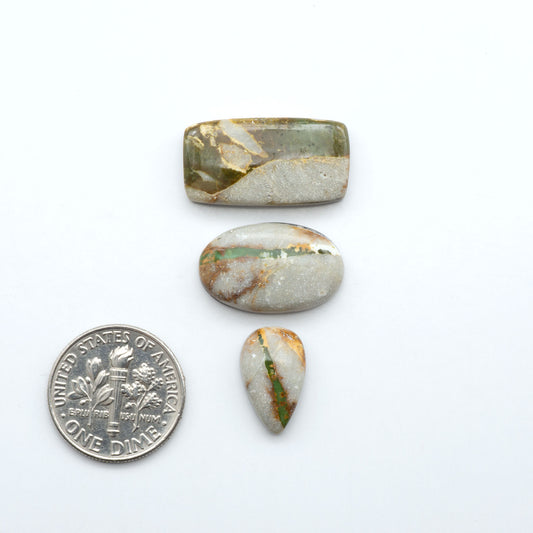 Royston Turquoise cabochons are famous for their distinctive matrix and unique green and blue hues, making them a favored option among jewelry designers.